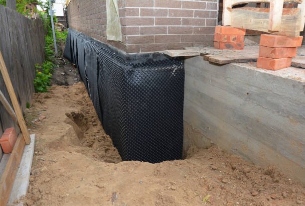 Happy homeowners after waterproofing job in Marlboro